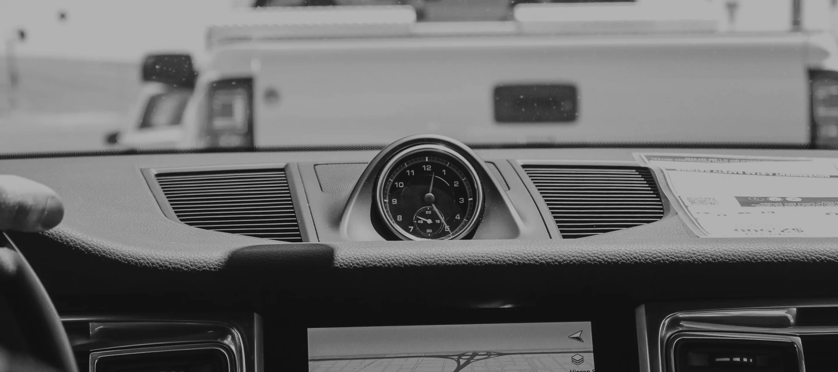 Interior close up of a car windscreen and dashboard