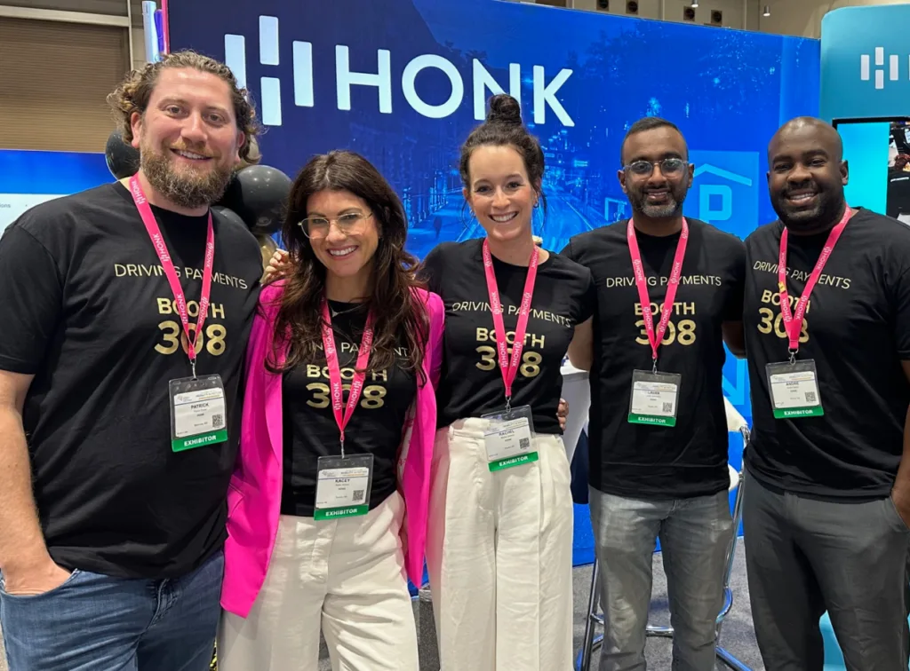 A group photo of the HONK team at an event.